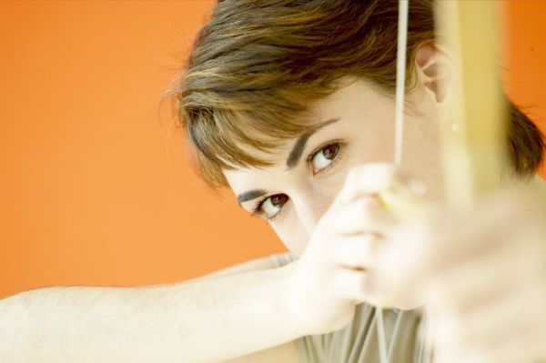 Woman aiming a bow