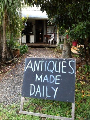 Sign that says "Antiques Made Daily"