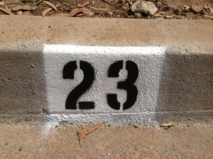 house numbers painted on the curb